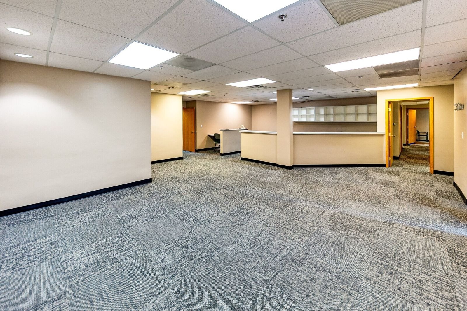 Open office workspace with reception counter at 7515 W Yale Ave, Denver