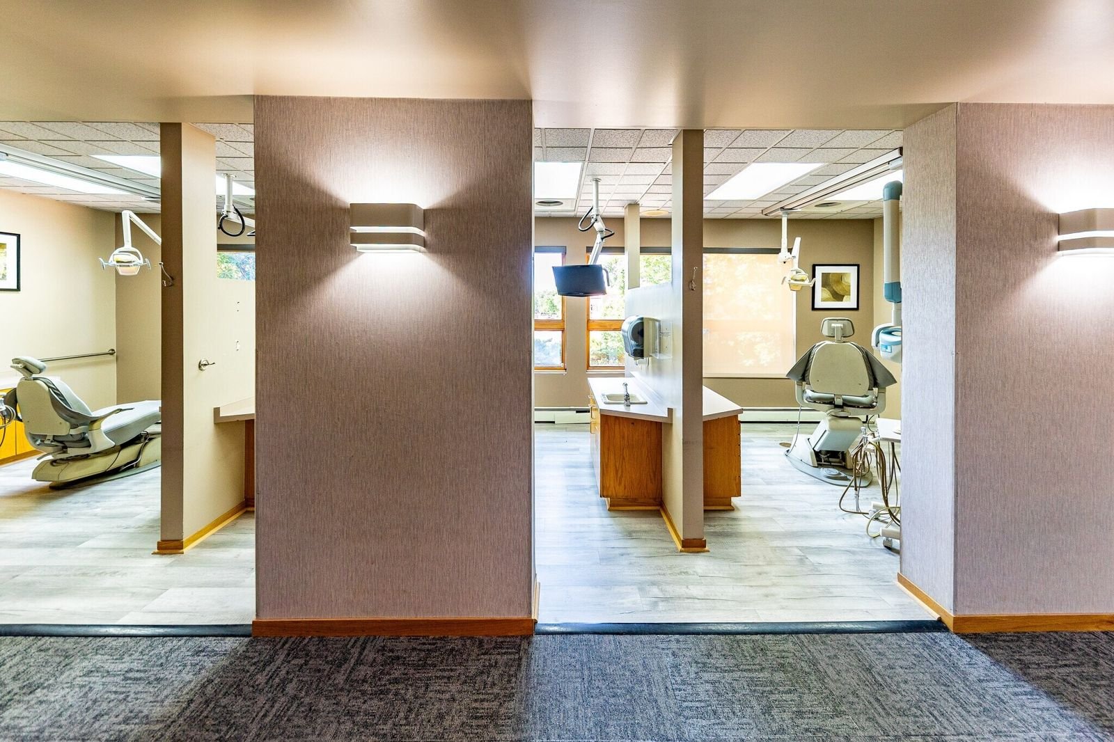 Central workstation with treatment areas beyond at 7515 W Yale Ave, Denver