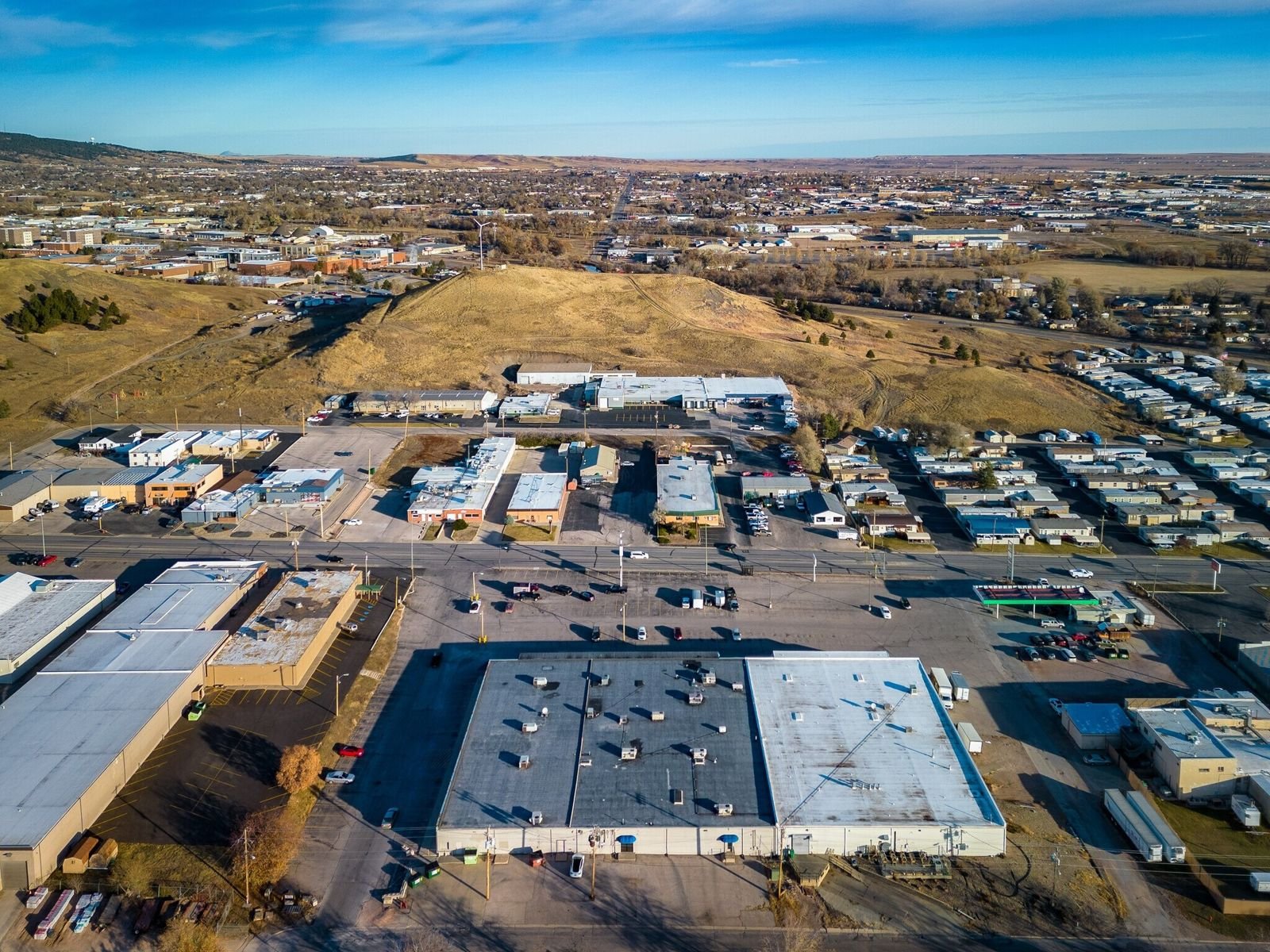 High aerial of Midland Shopping Center with Rapid City hills beyond