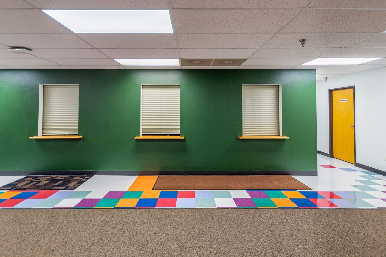Suite reception with service windows and tile floor at Midland Shopping Center, Rapid City