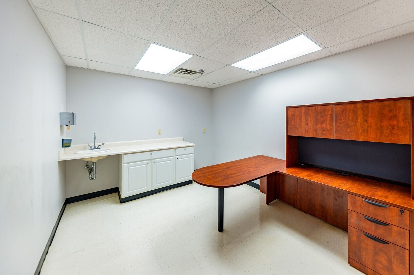 Suite workroom with built-in cabinetry and sink at Midland Shopping Center, Rapid City